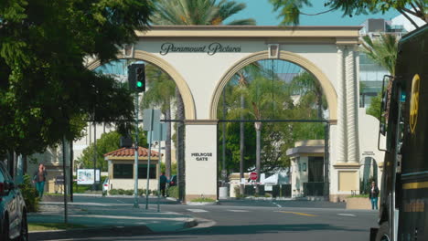 A-Timelapse-of-the-Paramount-Pictures-Gates-on-Melrose-Avenue-in-Hollywood-with-Traffic-and-Pedestrians