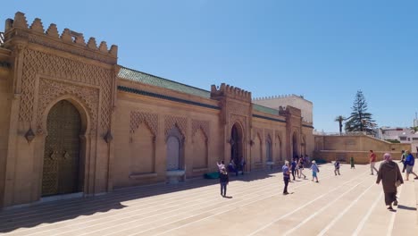 Visitors-around-Rabat's-Hassan-Tower-and-Al-Hassan-Mosque,-Morocco
