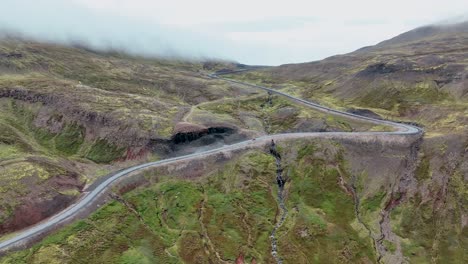 Aerial-View-Of-Mountain-Road-In-East-Iceland---drone-shot
