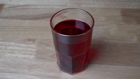Glass-With-Red-Currant-Syrup-On-Table