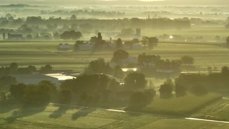 Fog,-mist,-and-dew-over-rural-farmland-in-USA-during-morning-sunrise