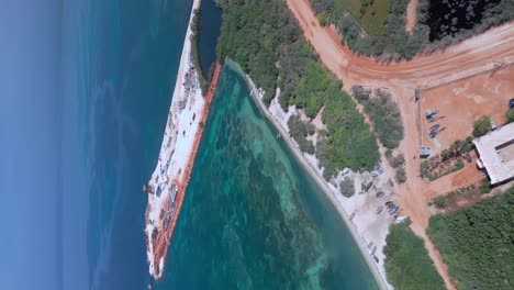 Vertical-View-Of-Construction-of-Puerto-Cabo-Rojo-Surrounded-By-The-Blue-Sea-In-Pedernales,-Dominican-Republic