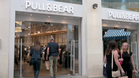Shoppers-engage-and-buy-goods-at-the-Spanish-multinational-clothing-design-retail-company-by-Inditex,-Pull-and-Bear-store