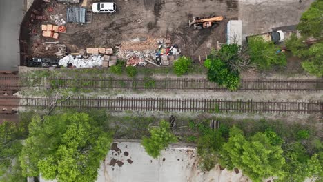 Top-down-shot-of-abandoned-railroad-tracks-outside-of-USA-city
