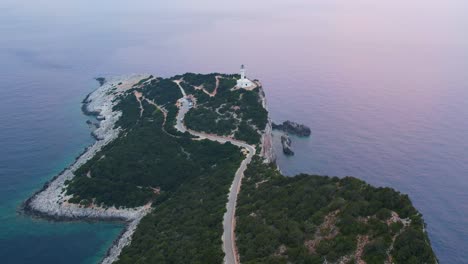 Aerial-Overhead-View-Of-Road-Leading-To-Doukáto-Lighthouse-On-Lefkada-Island-Surrounded-By-Calm-Sea-Waters