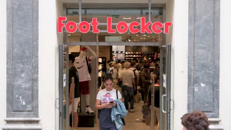 Customers-buy-goods-and-inventory-from-the-American-multinational-sportswear-and-footwear-retailer,-Foot-Locker,-store