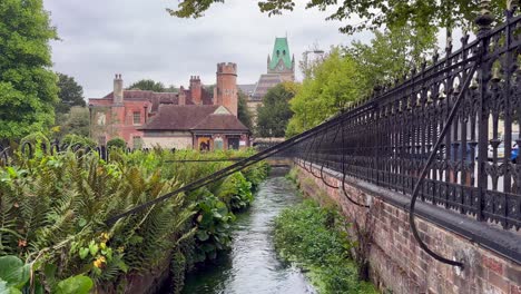 Shot-of-the-River-Itchen-in-Winchester-with-railings-and-flora