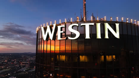 Cinematic-drone-shot-of-WESTIN-Logo-brand-in-facade-of-modern-Tower-in-Atlanta-City,Georgia