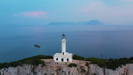 Aerial-Flying-Over-Doukáto-Lighthouse-On-Lefkada-With-Island-Misty-Landscape-Sea-In-Background