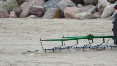 Tractor-Dragging-Harrow-On-The-Sand