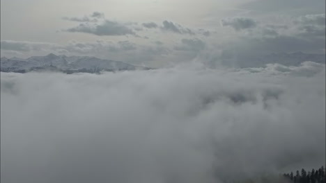 Aerial-View-Above-Clouds-with-Dramatic-Cloud-Cover