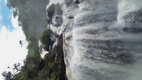 Dramatic-vertical-aerial-towards-Colnett-Waterfall,-Hienghene-New-Caledonia