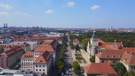Majestic-aerial-top-view-flight-street-road-City-town-Munich-Germany-Bavarian-National-Museum,-summer-sunny-cloudy-sky-day-23
