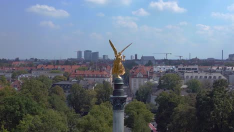Magic-aerial-top-view-flight-Gold-Angel-of-Peace-column-City-town-Munich-Germany-Bavarian,-summer-sunny-cloudy-sky-day-23