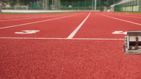 Athletic-track,-start-line,-starting-block,-ground-level-shot