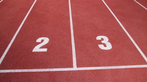 Athletic-track-for-110-meters-race,-with-eight-lines,-high-angle-shot