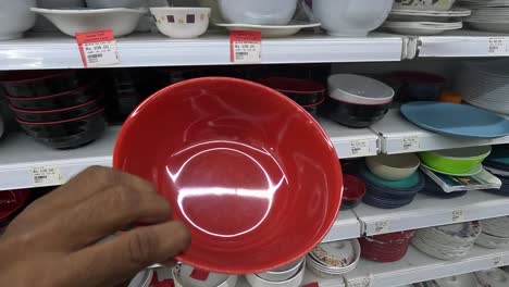 POV-shot,-customer-shopping-for-ceramic-decorative-bowls-at-shopping-mall