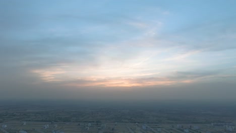 Sunset-view-is-hidden-behind-the-clouds-and-city-pollution-in-a-big-city-of-Pakistan,-Karachi,-Pakistan