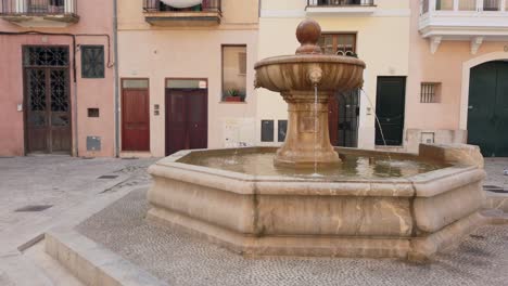 Picturesque-square-of-Palma-de-Majorca-with-its-monumental-fountain-in-the-center