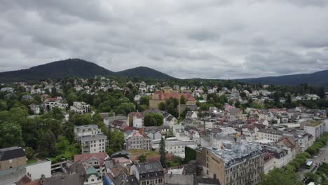 Baden-Baden-aerial:-historic-architecture-against-a-mountainous-backdrop,-Germany