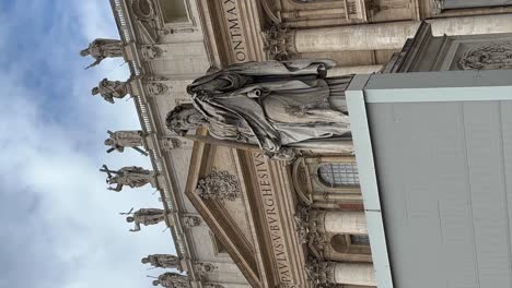 Vertical-panning-shot-of-a-statue-outside-the-Vatican