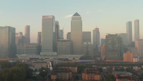 Aerial-slider-shot-of-Canary-Wharf-skyscrapers-from-Poplar-at-sunrise