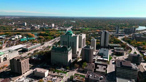 Aerial-Drone-Timelapse-of-the-Fort-Garry-Hotel-and-the-Canadian-Museum-for-Human-Rights-and-The-Forks-Market-in-Downtown-Western-Blue-Sky-Fall-Harsh-Sunlight-Winnipeg-Manitoba-Canada