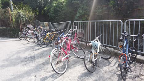 Colorful-Bicycles-Parking-Lot-next-to-a-Mountain-Forest-in-Kyoto-Japan-in-Summer