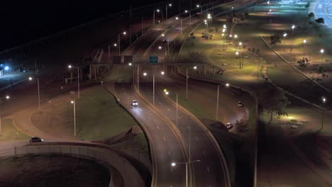 Aerial-view-of-waterfront,-and-highways-of-Posadas,-Misiones,-Argentina-at-night