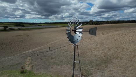 Course-Lock-Shot-Of-Windmill-At-Farm,-Margaret-River-Region,-Western-Australia
