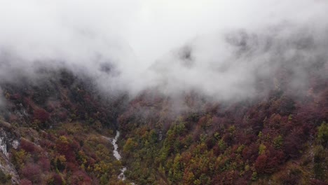 Epic-cinematic-aerial-scenery-of-steep-mountain-hill-in-fall