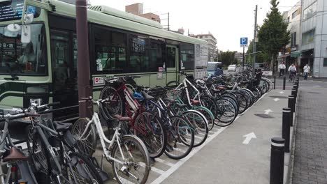 Bicycle-Parking-Lot-and-Street-Traffic-in-Kyoto-Japan-People-Bus-Driving-Summer-in-Demachiyanagi-Station-Sakyo-Ward
