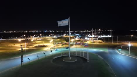 Flag-of-Argentina-in-the-middle-of-roundabout-in-heavy-wind-at-night