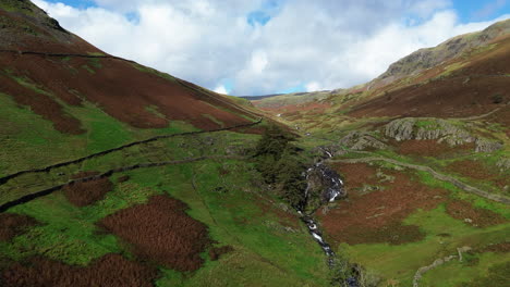 Rising-aerial-shot-of-stream-and-fells-in-the-lake-district