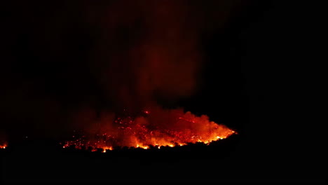 Shot-of-bright-hot-lava-burning-in-Malaga,-Spain-at-night-time