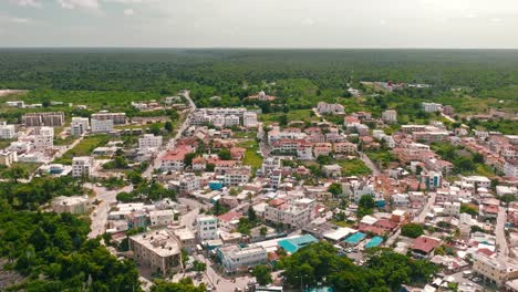 Drone-flying-over-Bayahibe-village-and-port,-La-Romana-in-Dominican-Republic