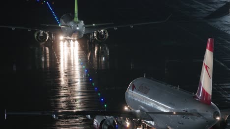 Airbus-pushed-back-behind-other-aircraft-during-the-night