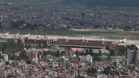 Tribhuwan-International-Airport-Kathmandu-Nepal,-dense-city-aerial-view