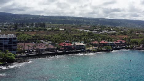 Aerial-close-up-panning-shot-of-the-historic-Kailua-Kona-waterfront-on-the-Big-Island-of-Hawai'i