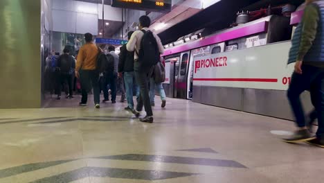 metro-station-view-with-metro-arriving-and-passenger-walking-from-different-angle-video-is-taken-at-janakpuri-west-delhi-india-Jan-04-2023