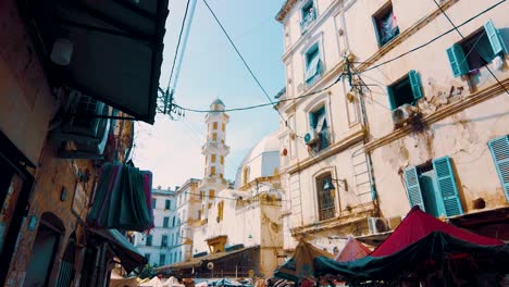 An-alley-in-the-popular-district-of-Bab-el-Oued-in-Algiers-which-overlooks-an-old-mosque-in-the-background