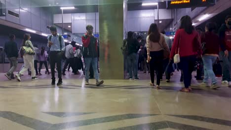 metro-station-view-with-metro-arriving-and-passenger-walking-from-different-angle-video-is-taken-at-janakpuri-west-delhi-india-Jan-04-2023