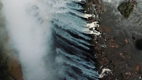 Vertical-Aerial-View-Victoria-Falls,-Shungu-Namutitima-at-the-Border-of-Zimbabwe-and-Zambia-in-Africa
