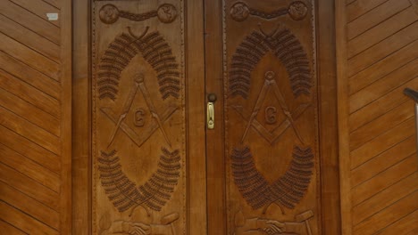 Close-up-of-wooden-doors-entrance-to-a-Masonic-temple