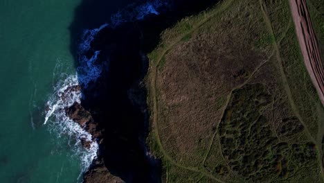 Cornwall-Coastline-Cliffs-from-an-Aerial-Top-Down-View-with-Green-Turquoise-Waters-Along-the-Coastline,-England,-UK