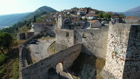 Entrance-Gate-to-Berat-Castle's-Historic-Fortress,-Ancient-Stone-Walls-and-White-Houses-Inside,-Tourism-Destination-in-Albania