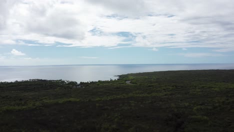Aerial-wide-rising-shot-of-Honaunau-Bay-with-Pu'uhonua-O-Honaunau-National-Historical-Park-along-the-coastline-of-the-Big-Island-of-Hawai'i