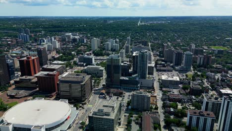 First-Ontario-Centre-drone-flyover-sunny-summer-day-overlooking-quiet-downtown-streets-of-Hamilton-Ontario-with-a-lush-green-horizon