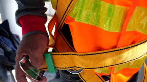 Asian-Man-Wearing-High-Safety,-Fall-Protection-Belt,-Close-Up