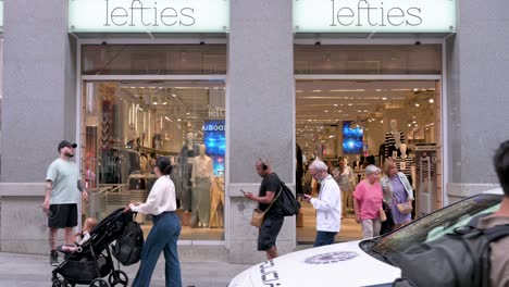 Shoppers-and-pedestrians-are-seen-at-the-Spanish-fashion-brand-owned-by-Inditex,-Lefties,-store-in-Spain